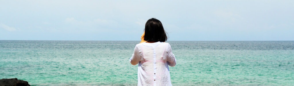 header lady at the beach